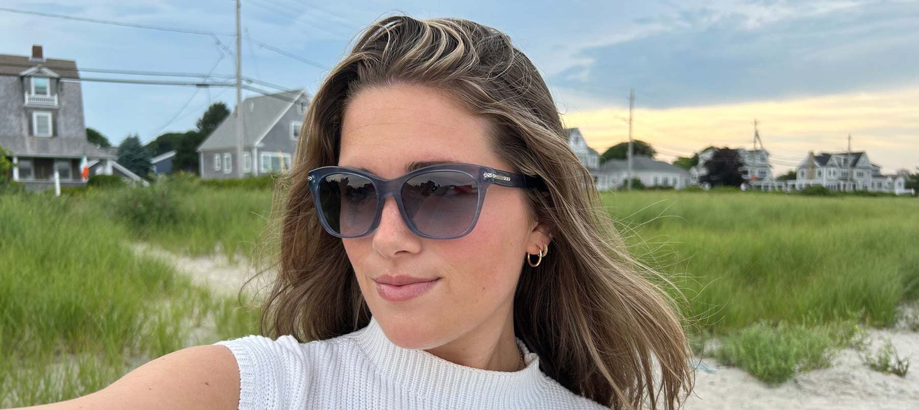 woman-on-beach-wearing-sunglasses