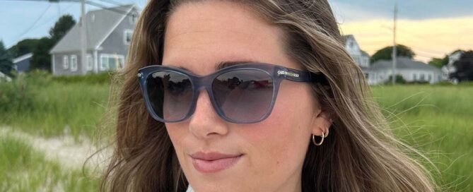 woman-on-beach-wearing-sunglasses