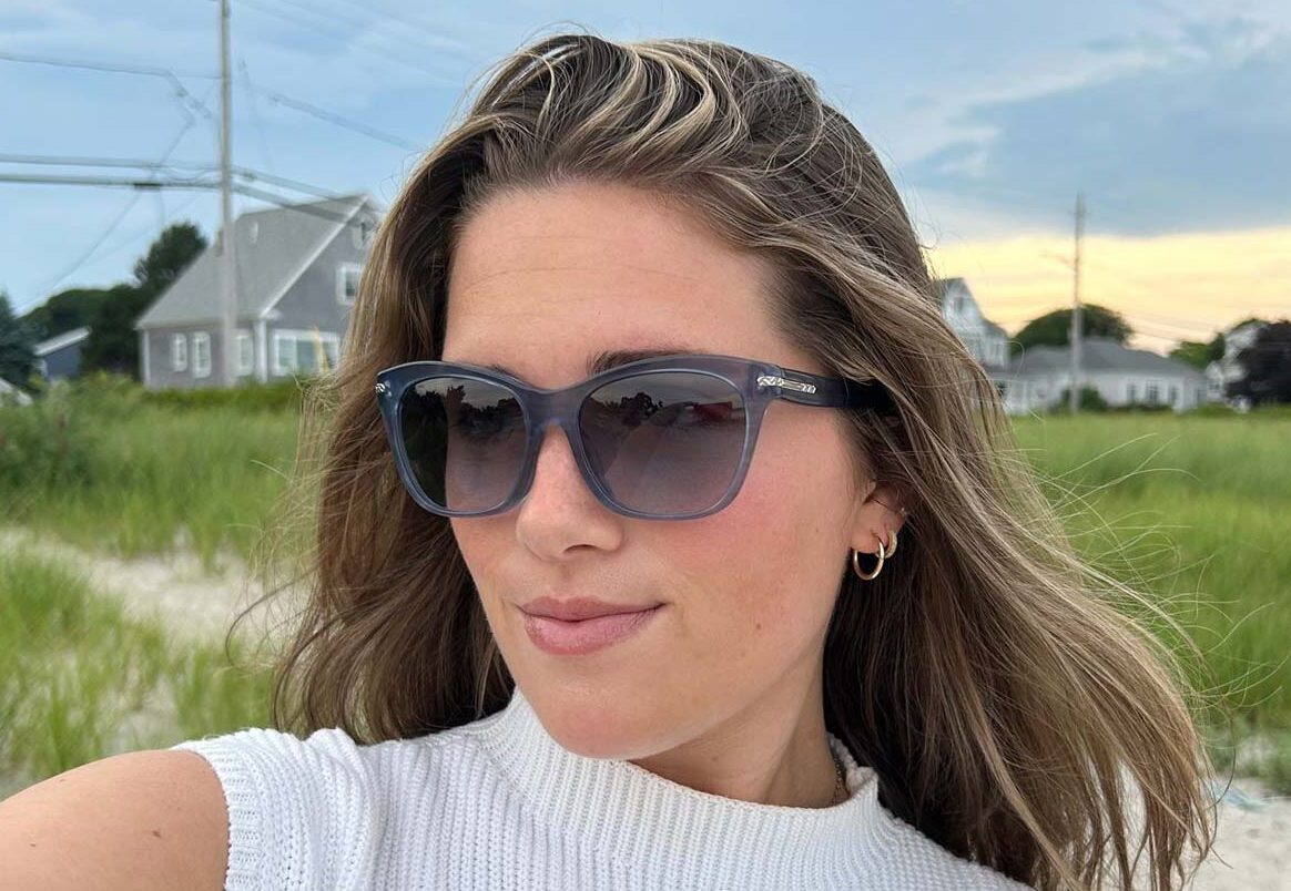 woman-on-beach-wearing-sunglasses